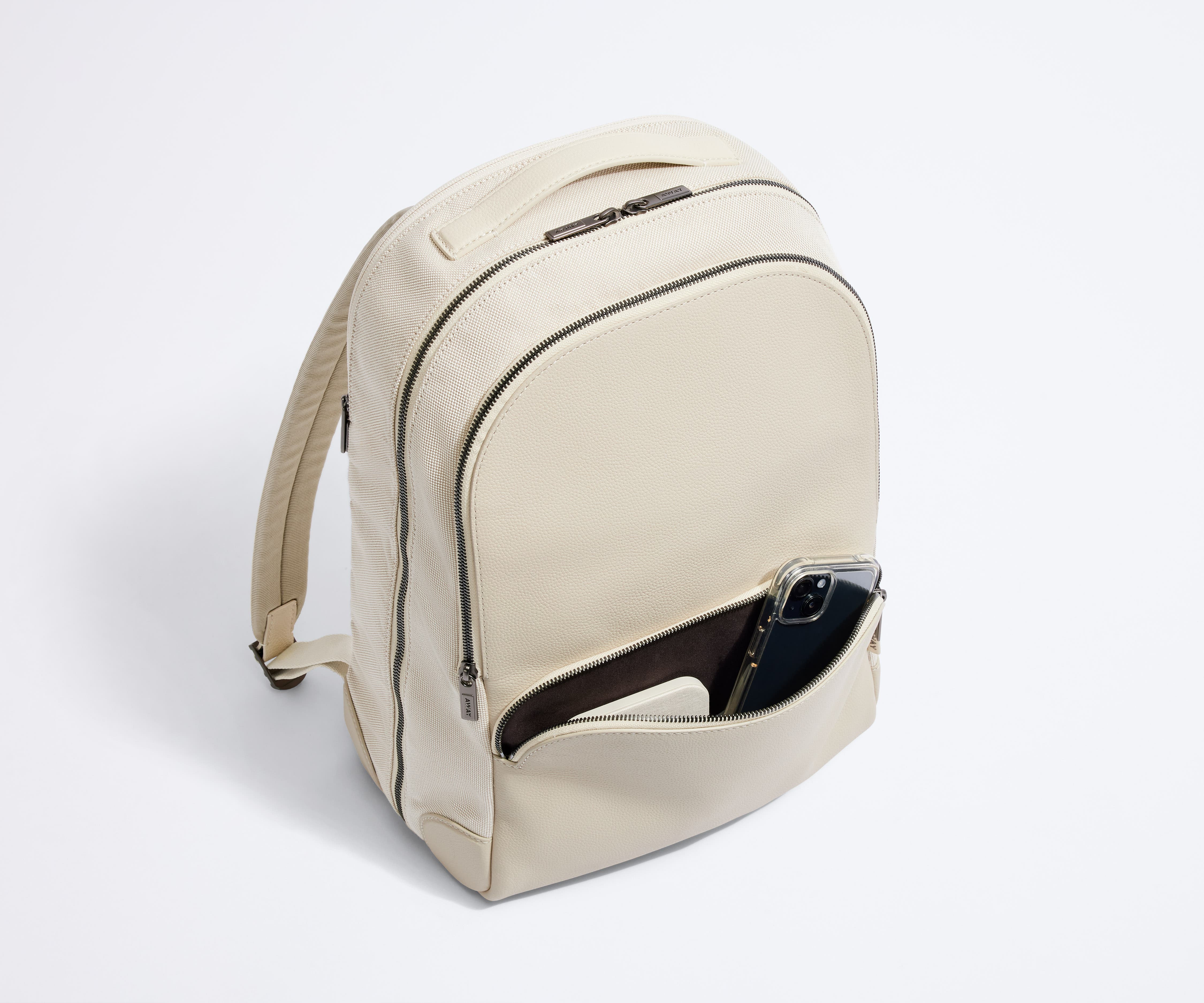 Exterior front pocket packed with a phone and portable charger