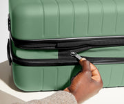 The Bigger Carry-On Flex suitcase in Sea Green has an additional wraparound zipper to expand the suitcase 2.25" (6 cm) and increase packing space