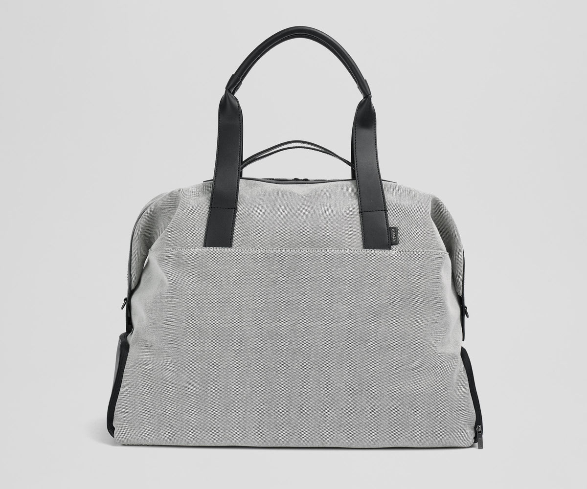 Front view of the Transit Canavs Weekender with its leather handles up