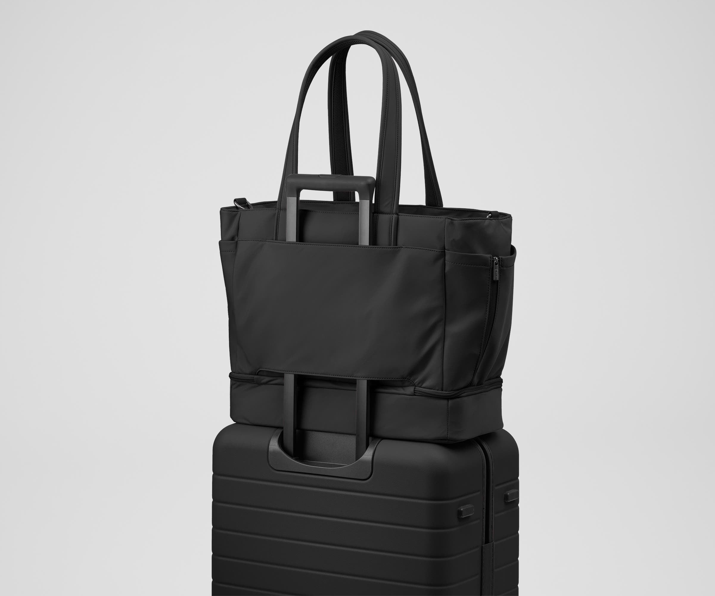 Double Diaper Tote on top of an Away suitcase by the trolley sleeve
