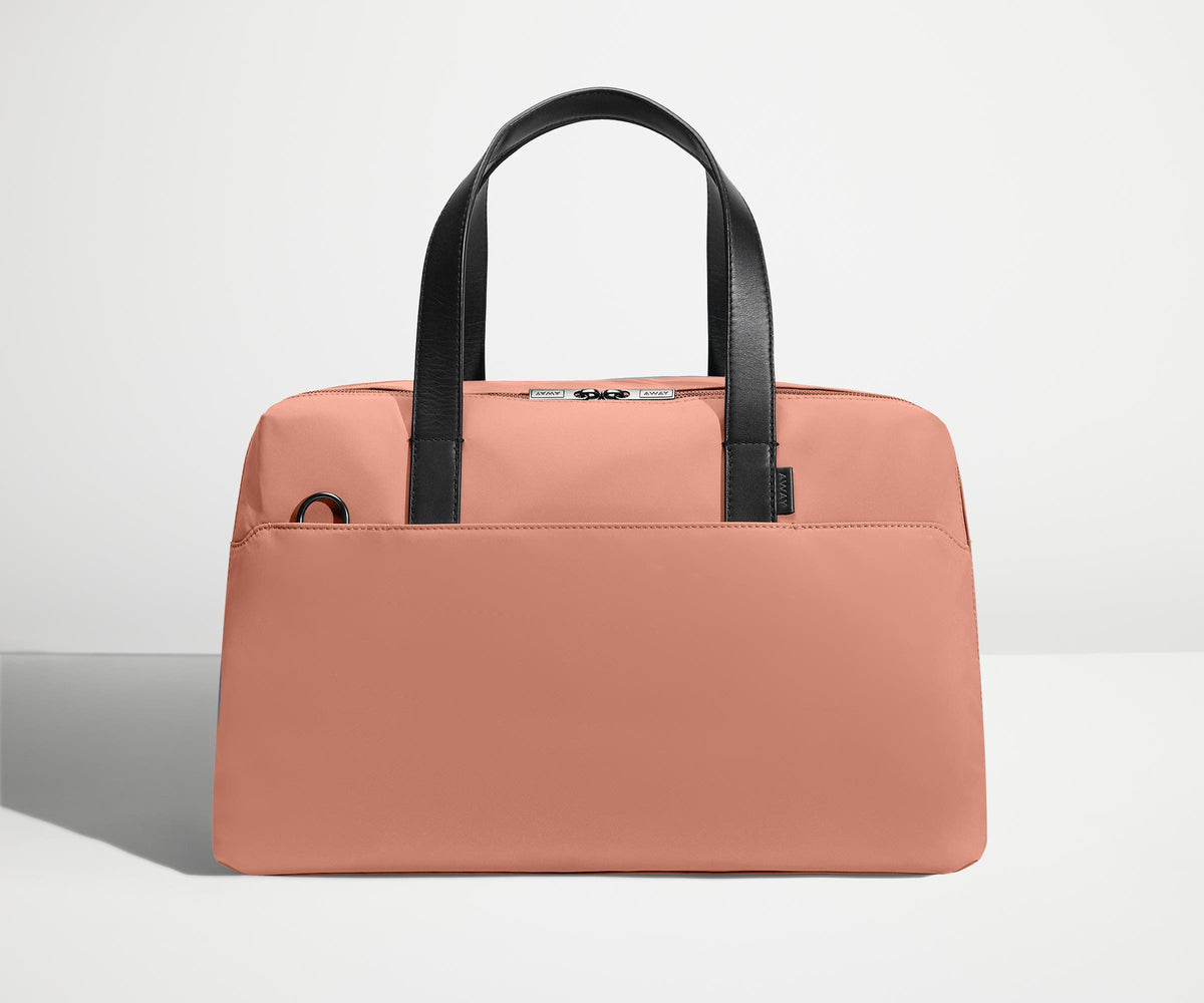 Front view of The Overnight Bag with leather straps up