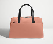 Front view of The Overnight Bag with leather straps up