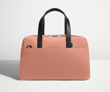 Front view of The Overnight Bag with leather straps up
