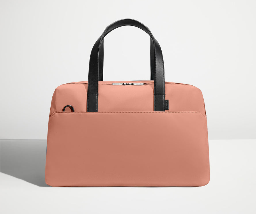 Front view of The Overnight Bag with leather straps up