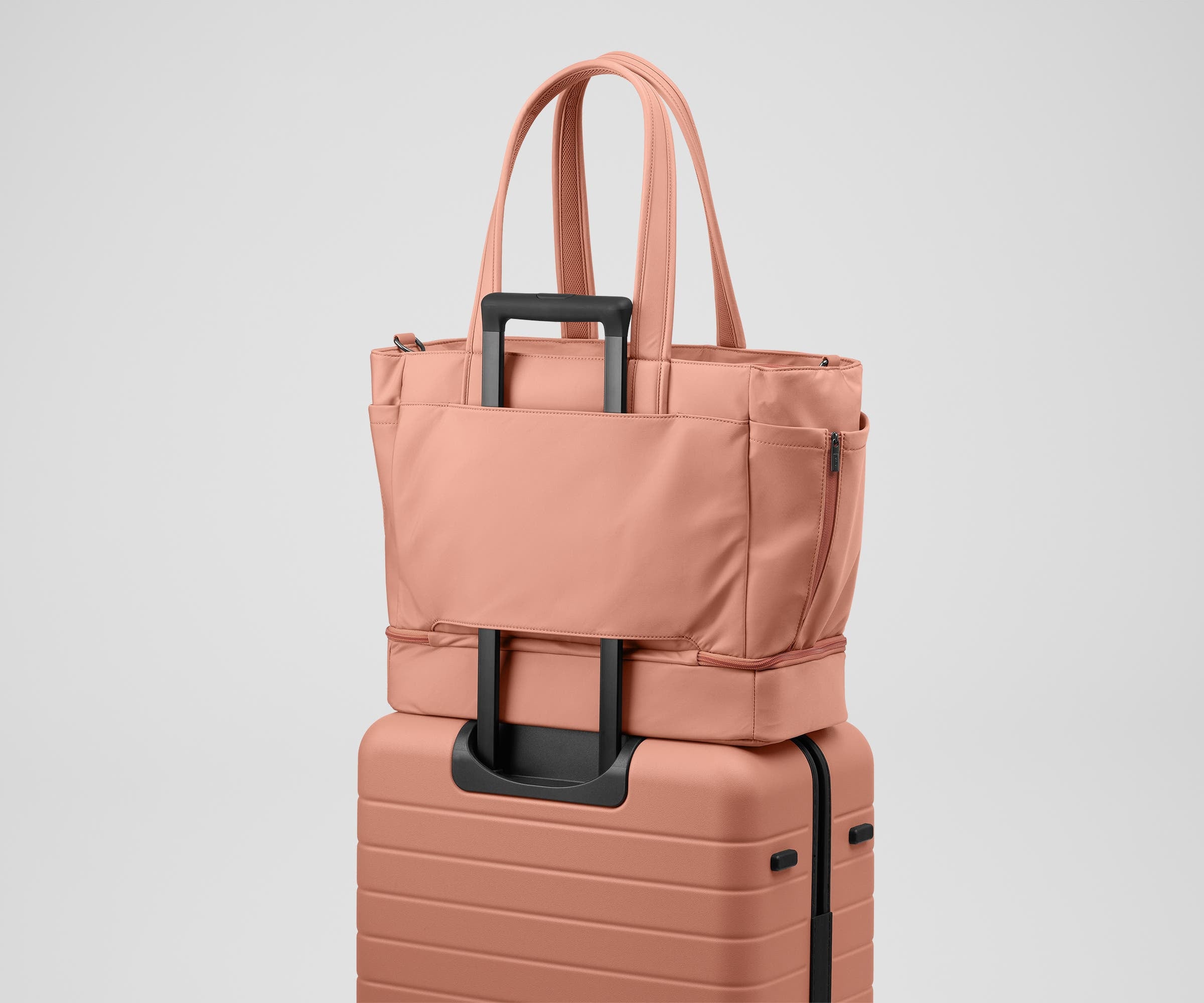 Double Diaper Tote on top of an Away suitcase by the trolley sleeve