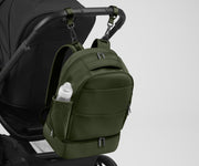 Backpack attached to a stroller using the included stroller clips