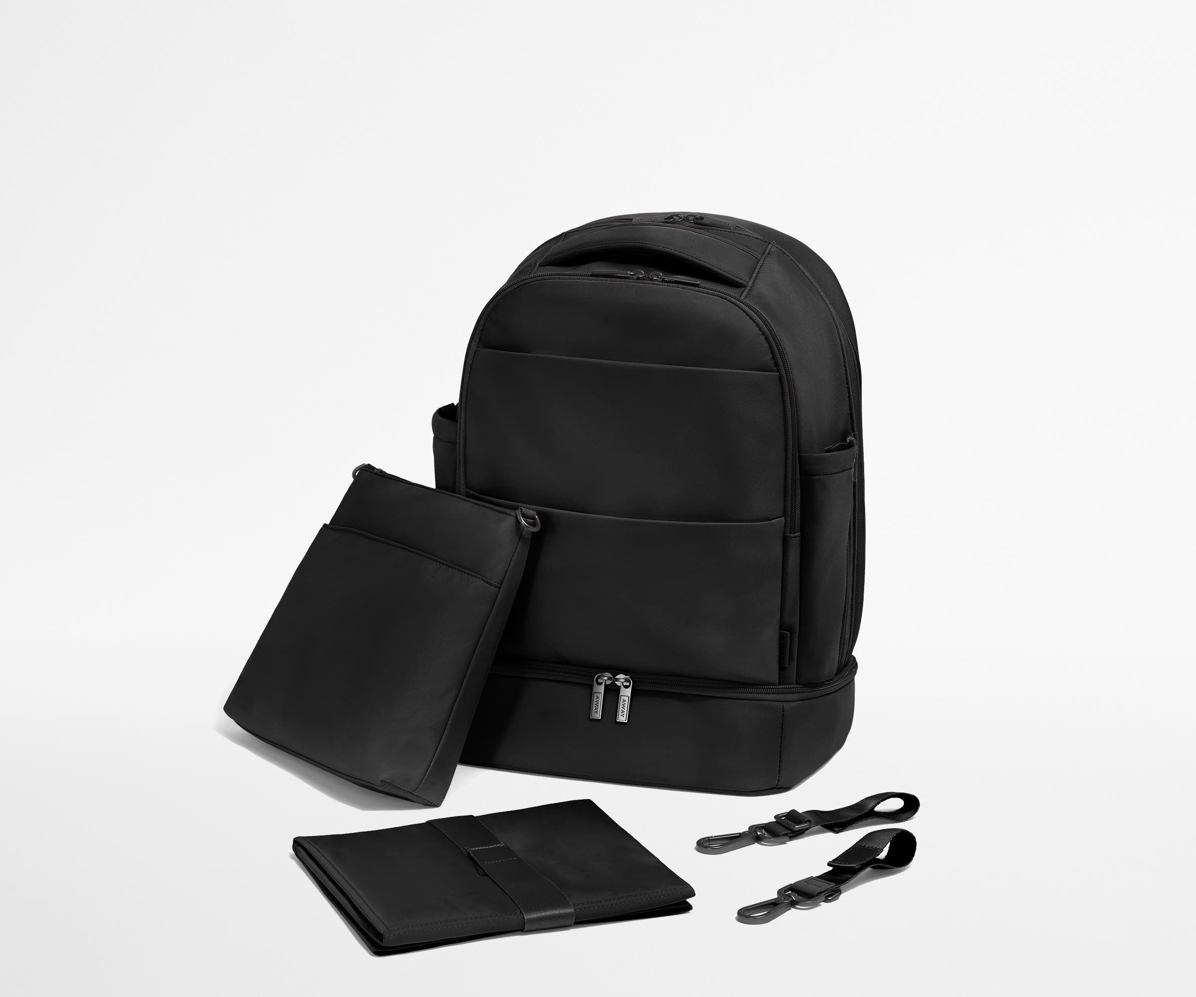 Backpack with the included stroller clips, carry-all pouch, and changing pad