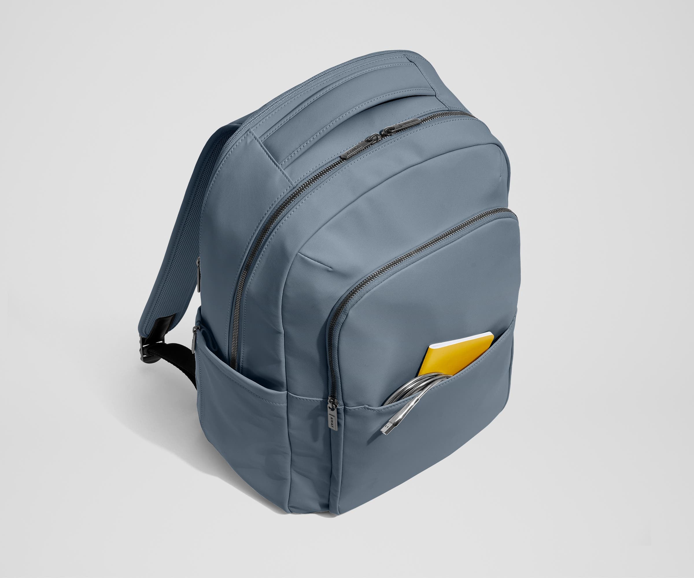 Front slip pocket with small notebook and charging cord