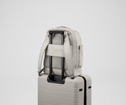 Double Diaper Backpack on top of an Away suitcase by the trolley sleeve