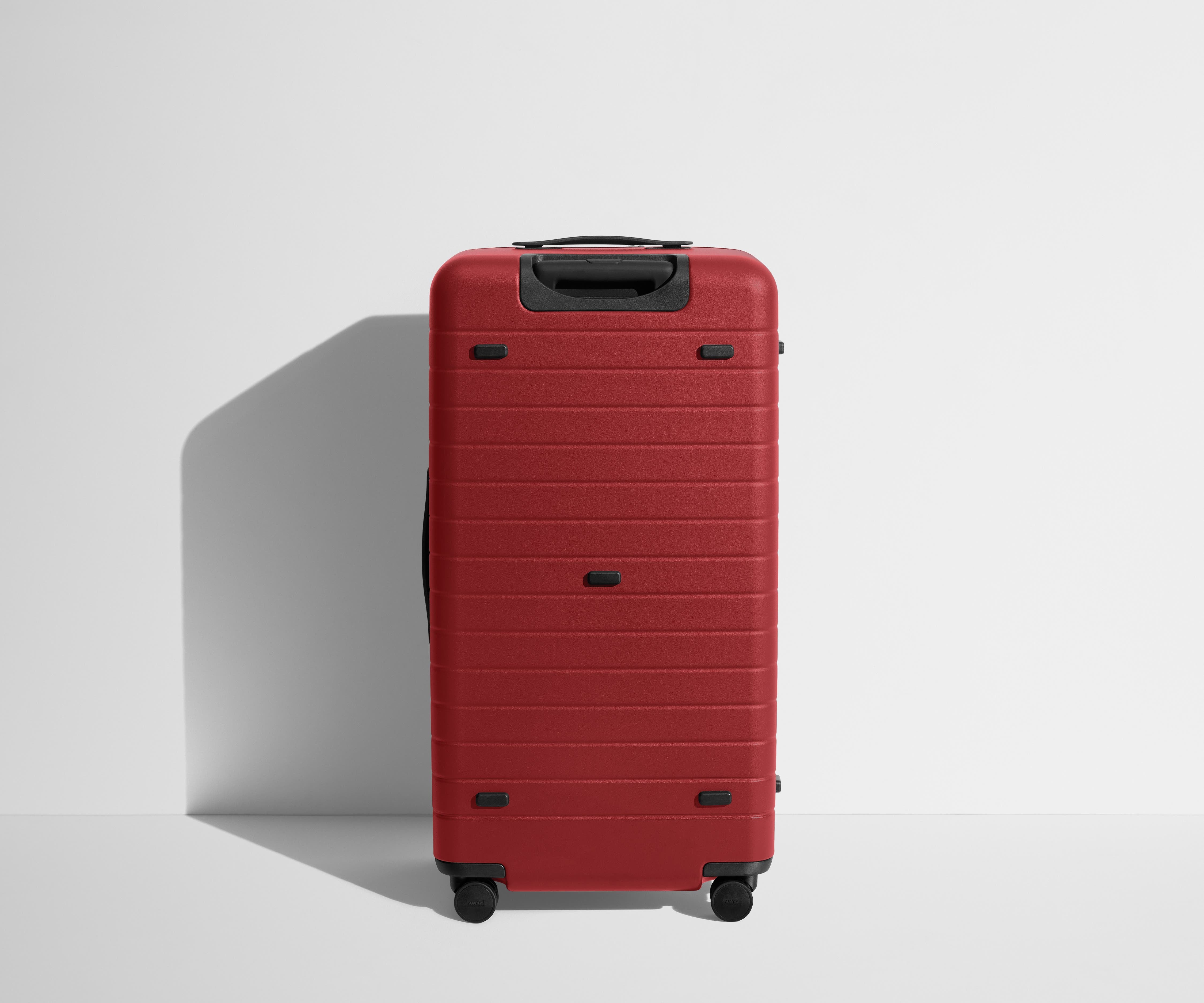 Back product view of The Trunk suitcase in Tango Red