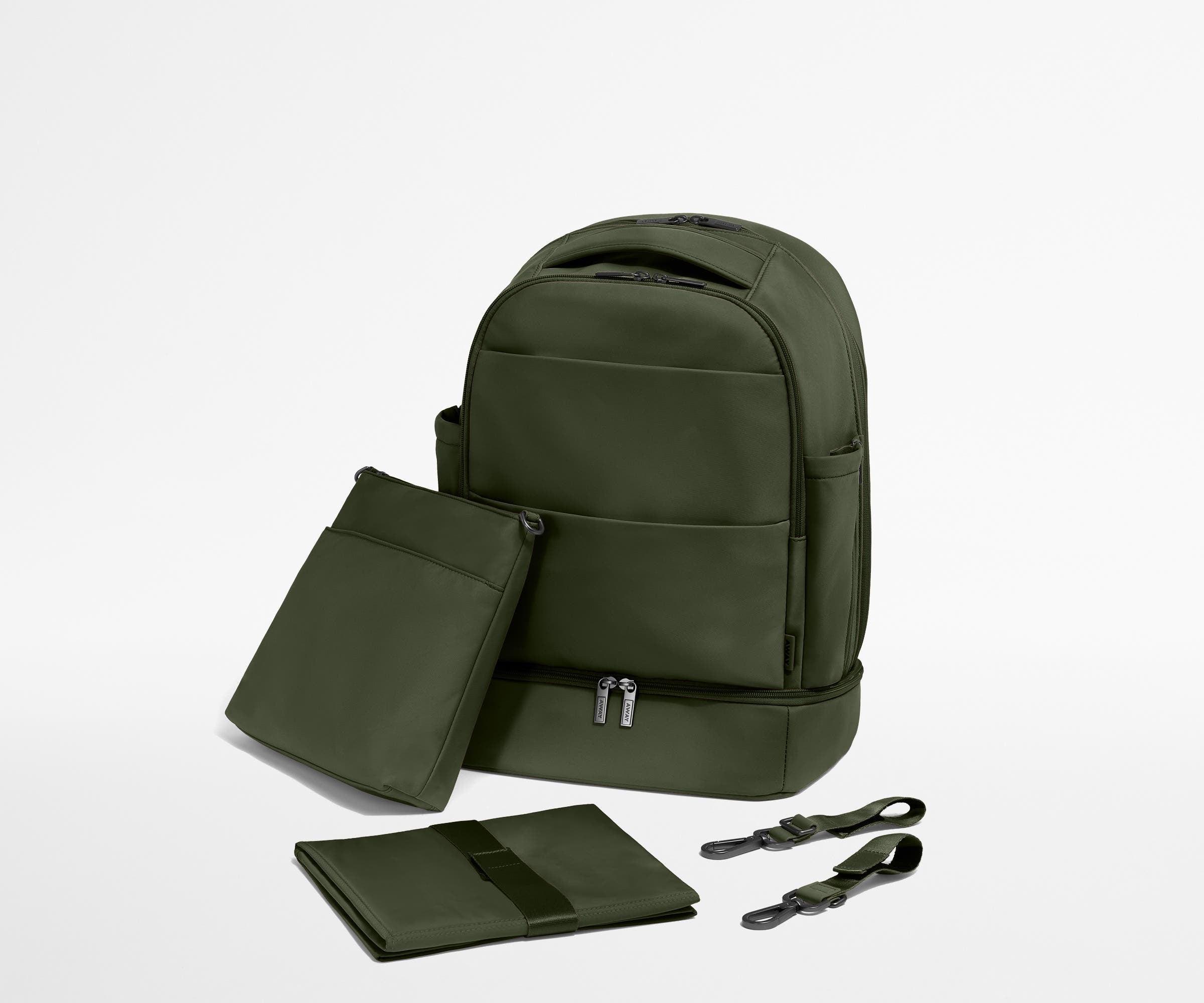 Backpack with the included stroller clips, carry-all pouch, and changing pad