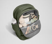 Front main compartment packed with child essentials, including a stuffed animal, wipes, and change of clothes