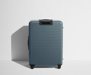 Back product view of The Large suitcase in Coast Blue