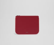 Front view of the small leather pouch with the Away logo
