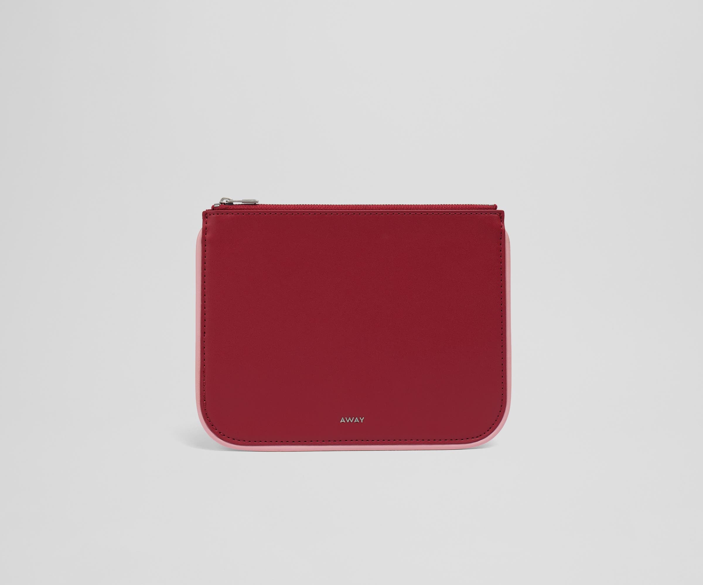 Front view of the small leather pouch with the Away logo
