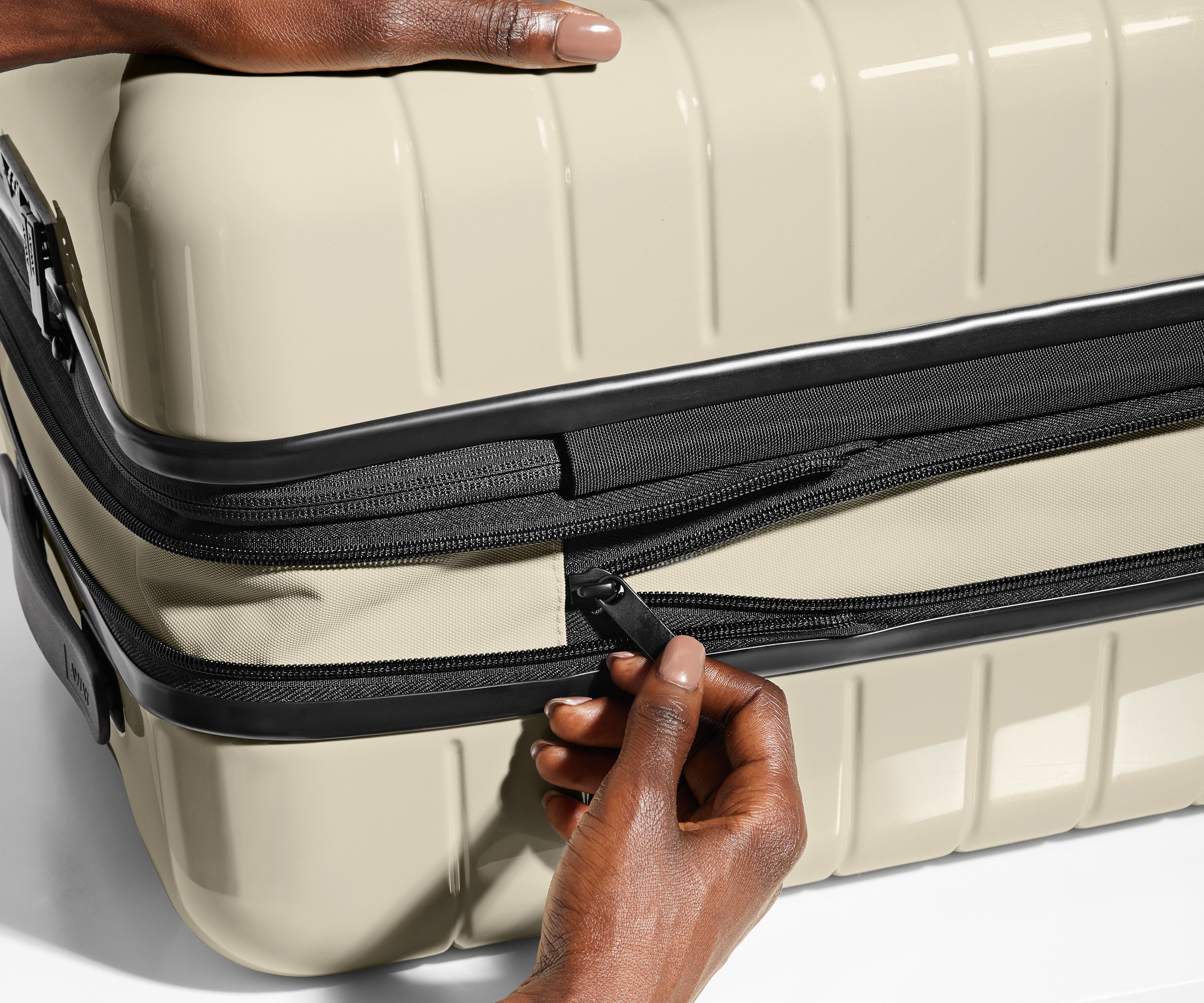 Hand unzipping the additional wraparound expandsion feature