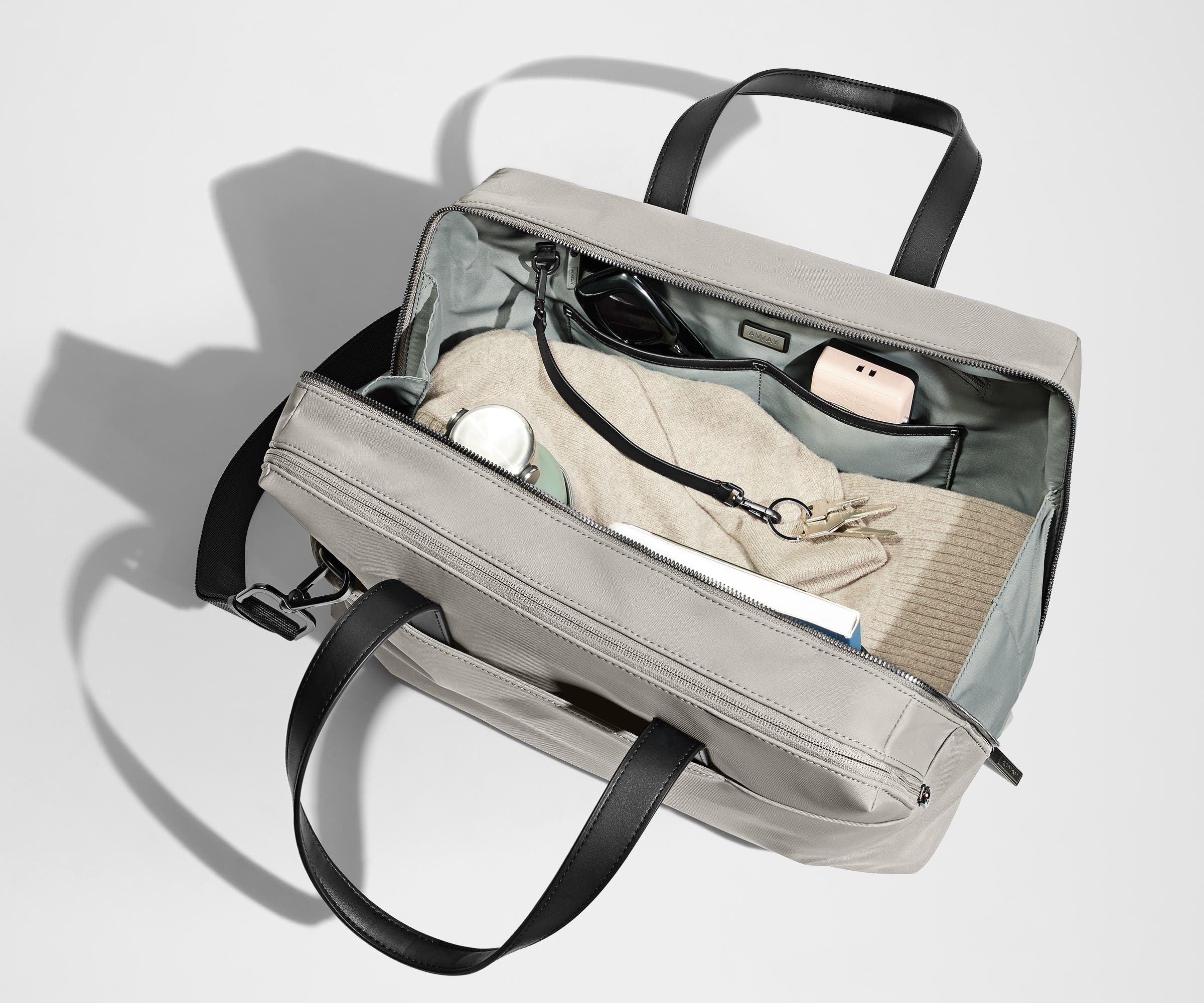 A pair of keys attached to the key leash in the main compartment
