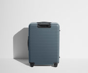 Back product view of The Medium suitcase in Coast Blue