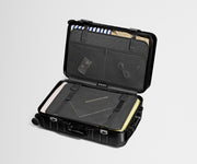 Packed view of an Aluminum Bigger Carry-On, showing the compression pad and interior organization