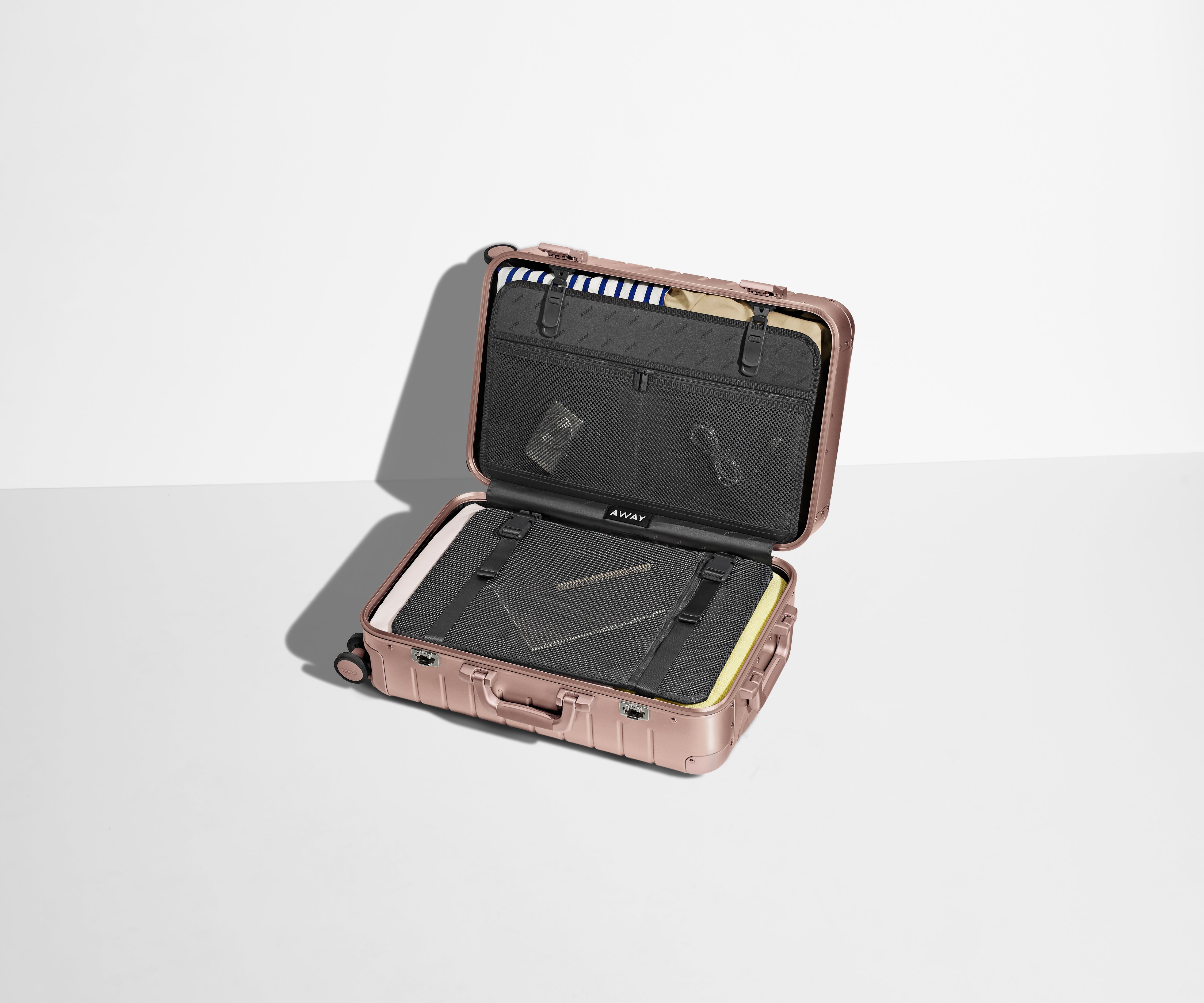 Packed Aluminum Bigger Carry-On showing the compression pad and interior organization