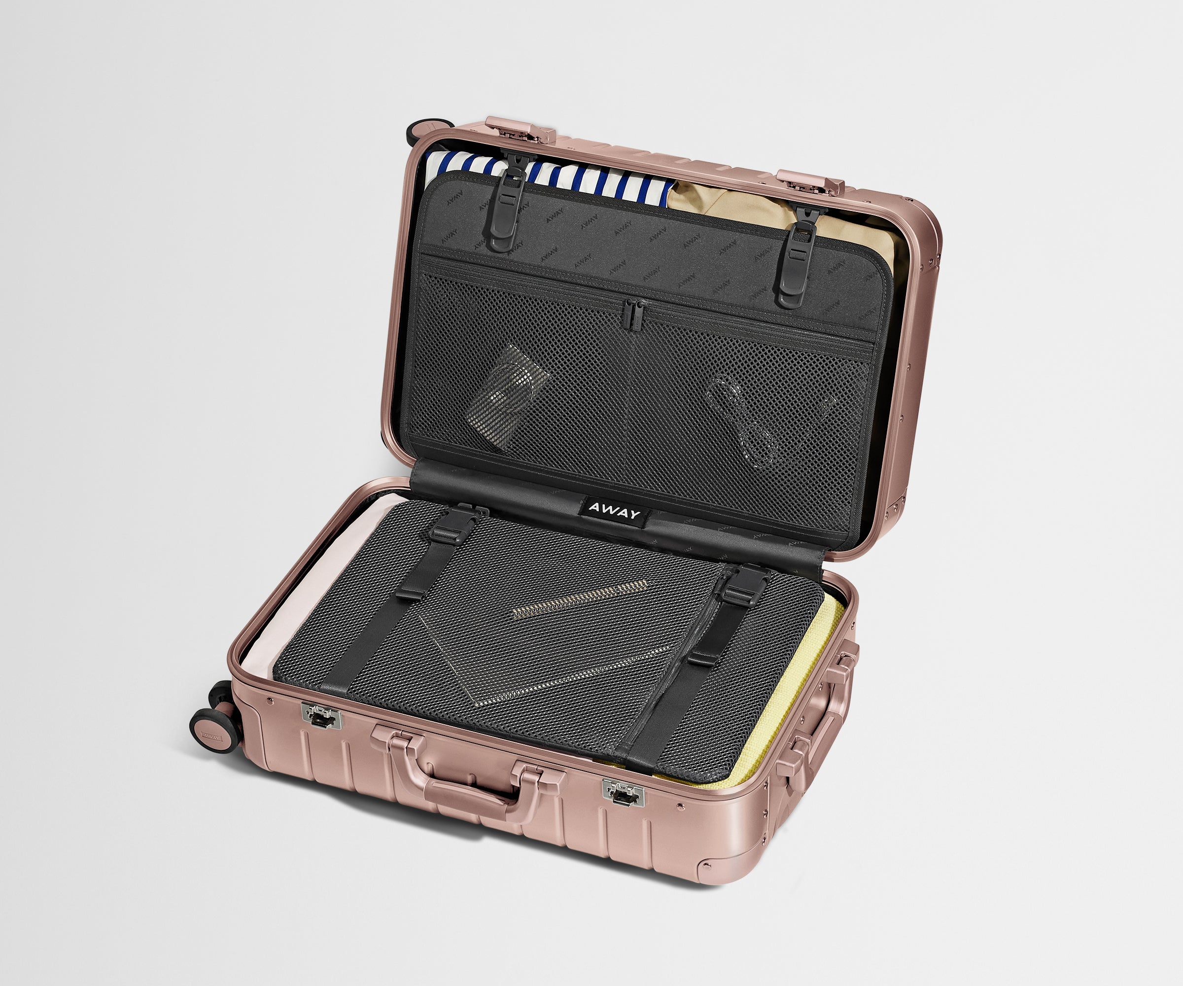 Open Aluminum Bigger Carry-On, showing compression pad system and interior organization