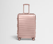 Front view of the Medium: Aluminum suitcase in Rose Gold with handles raised