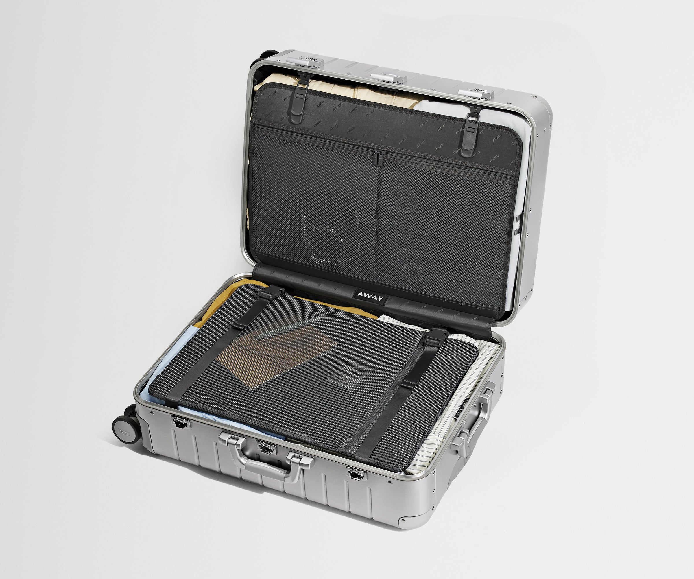 Medium: Aluminum Edition packed, showing the compression pad system and interior organization