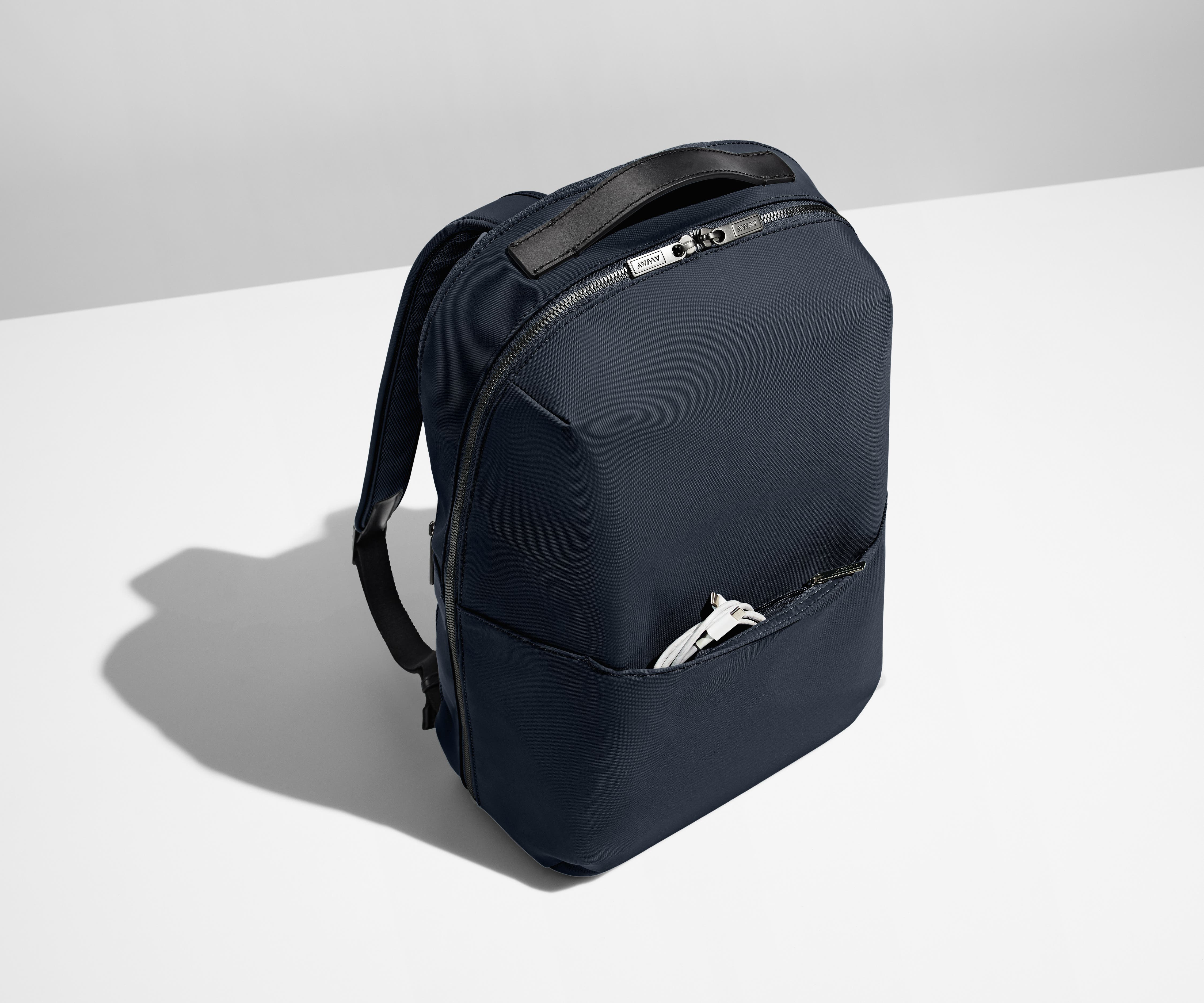 Exterior front pocket packed with a charging cord