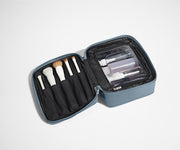 Cosmetics Bag packed with make up brushes and skincare