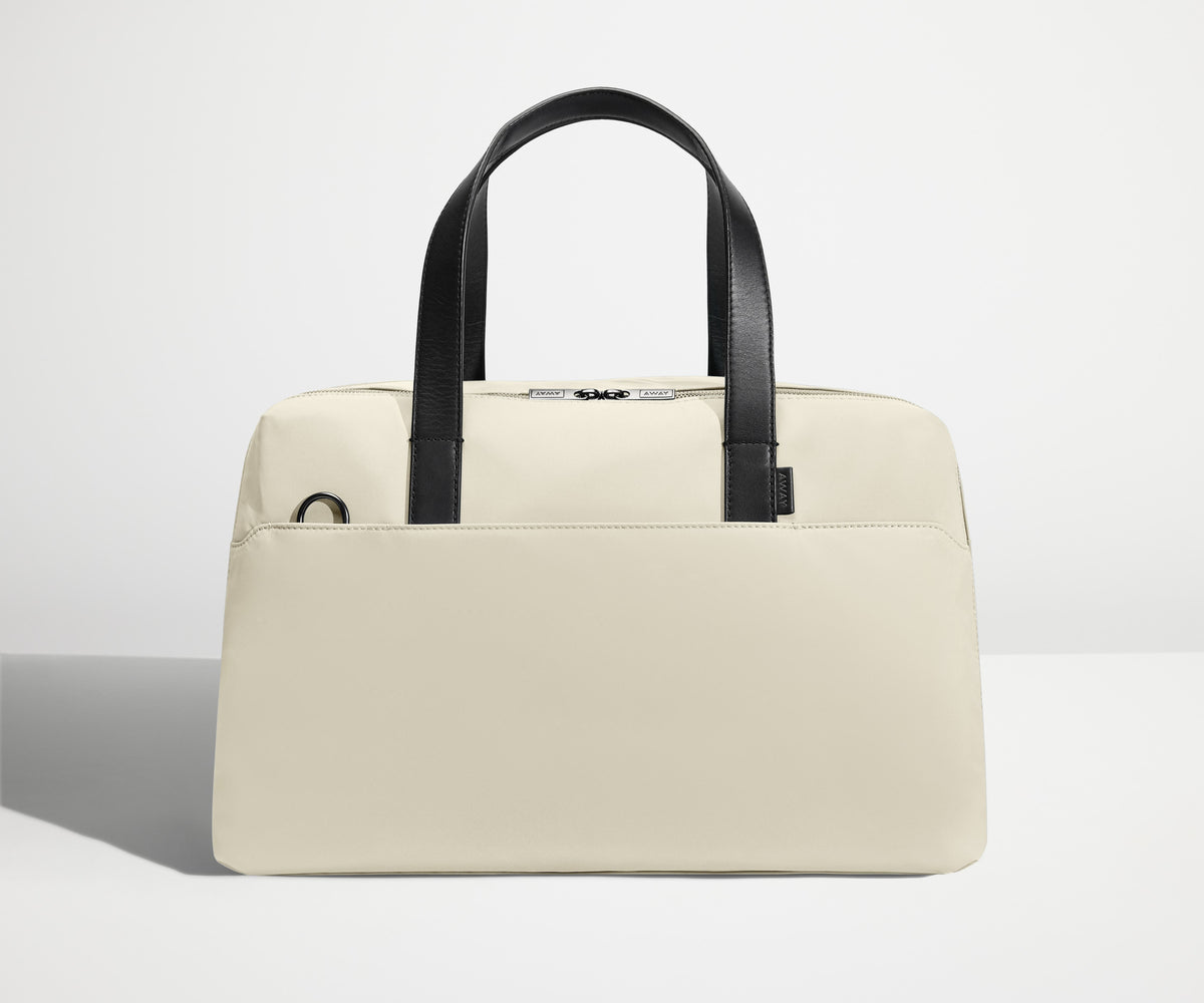 Front view of The Overnight Bag with leather straps up