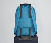Active Backpack 26L secured to an Away suitcase