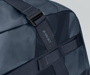 Close up view of the abrasion-resistant material and Away logo