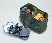 Active Tote 45L packed with clothing, hiking boots, helmet, and other outdoor gear