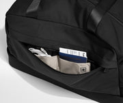 Front zipper pocket with phone and passport in their dedicated travel pockets