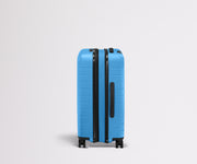 Side product view of The Bigger Carry-On Flex suitcase in Splash Blue shown fully expanded