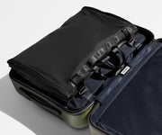 Folded Garment Sleeve packed and clipped inside The Bigger Carry-On