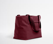 Maroon tote bag on a light gray background