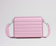 Pink crossbody bag on a light gray background