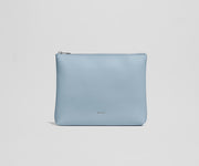Light blue pouch with a brand logo on a light gray background