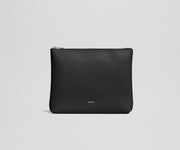 Black pouch with 'AWAY' branding on a light gray background