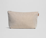 Beige pouch with a zipper on a light gray background
