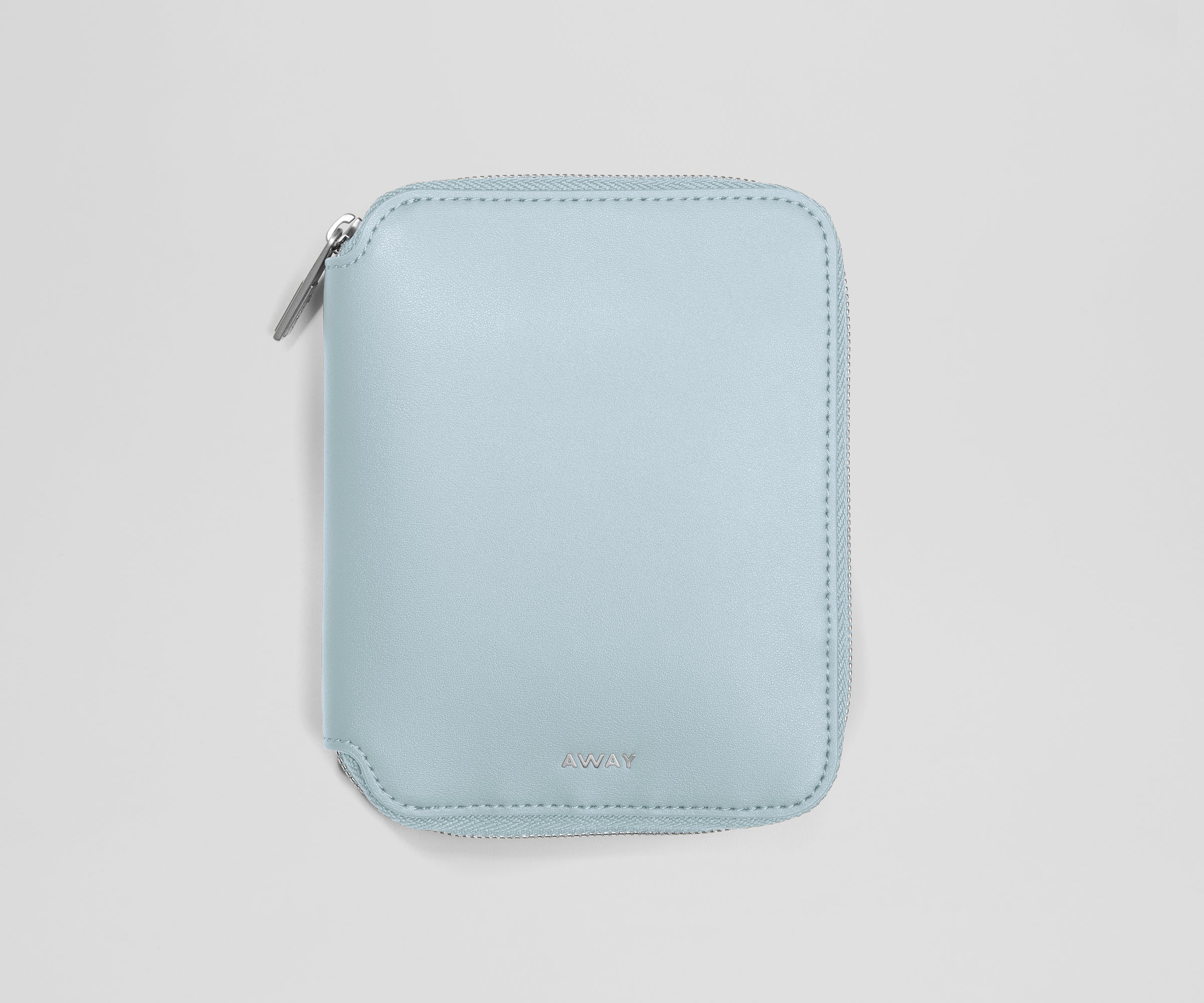 Light blue zippered jewelry organizer on a light gray background