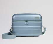 Blue makeup case with a strap on a light gray background