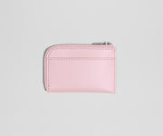 Pink wallet with a zipper on a light gray background
