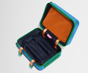 The Kids Carry-On suitcase in Splash Blue shown open and empty on its side to show capacity