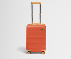 Front product view of The Kids Carry-On suitcase in Poppy Orange with raised handle