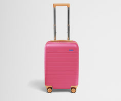 Front product view of The Kids Carry-On suitcase in Cotton Candy Pink with raised handle
