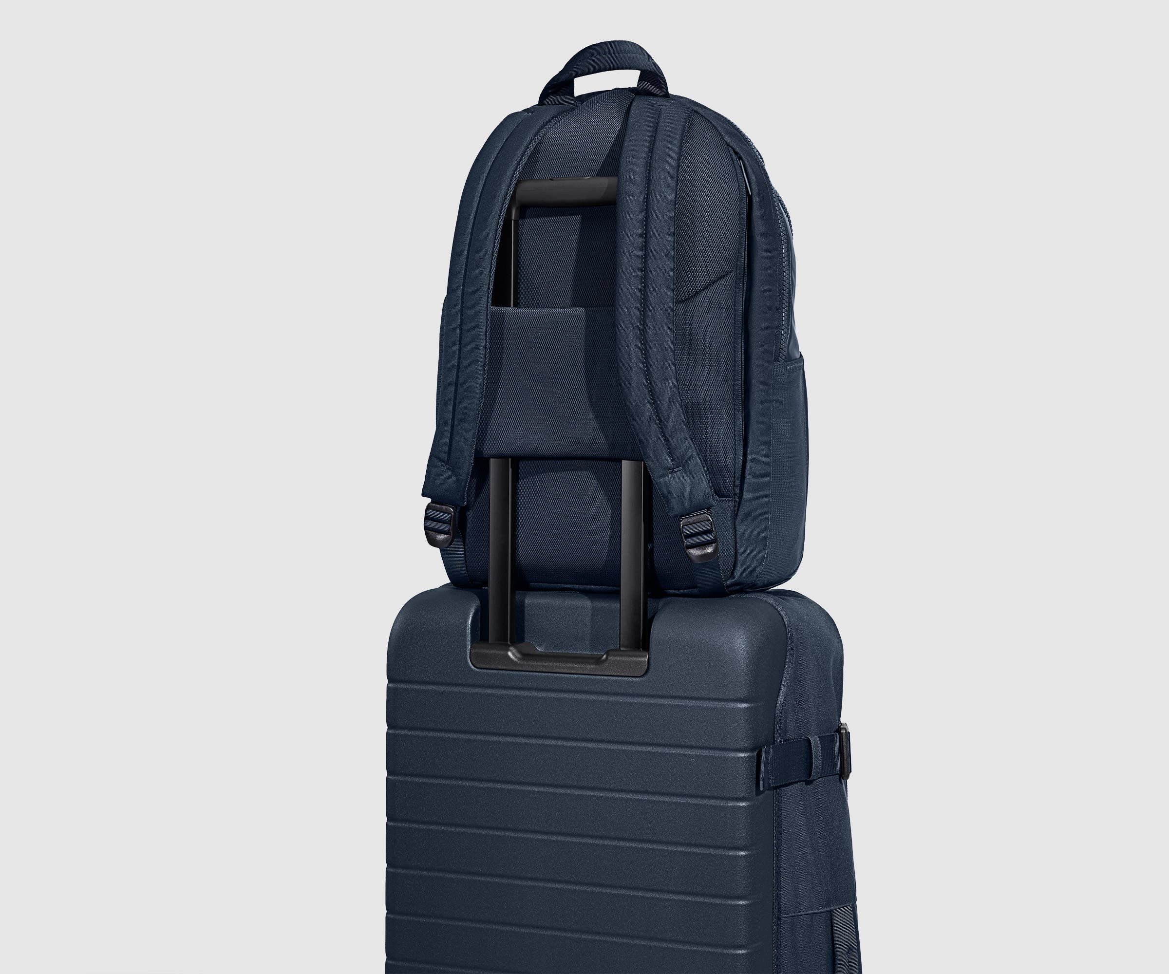 Active Backpack 26L secured to the Active Rolling Duffle 85L by its trolley sleeve
// Designed with a trolley sleeve that slides onto your suitcases to keep it in place while you're on the move. Paired with the Active Rolling Duffle 85L. 