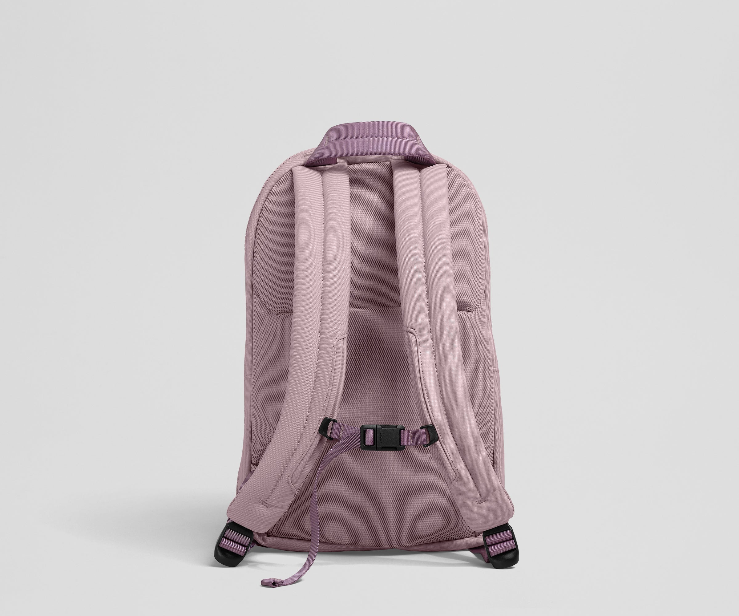 Back view showing the trolley sleeve, padded shoulder straps, and removable chest strap
