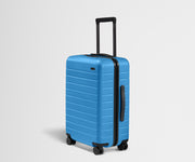 Angled product view of The Bigger Carry-On suitcase in Splash Blue